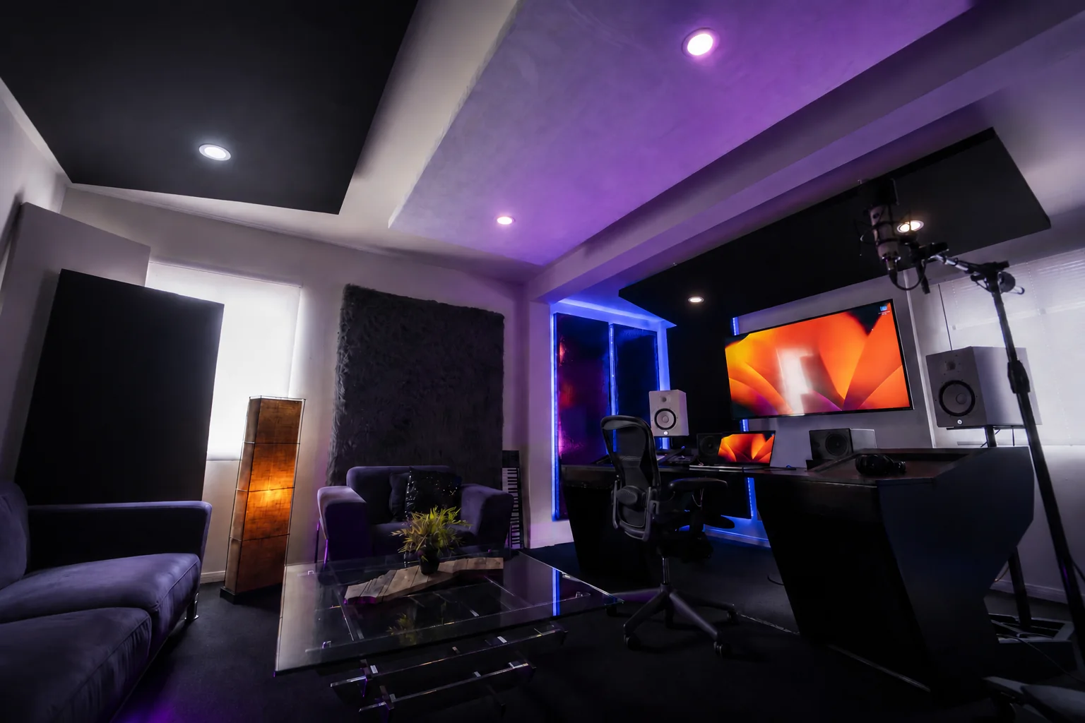 Wide view of Studio A showing the workstation, seating and acoustic treatment