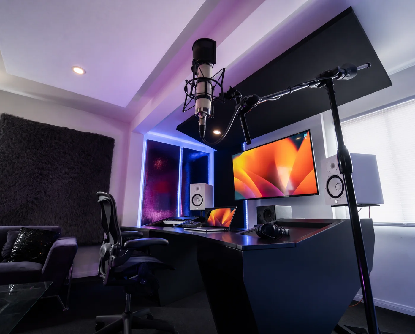 Studio A microphone and production workstation viewed from the lounge area